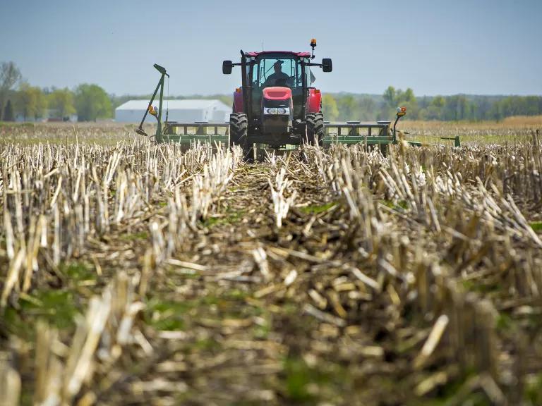 A combine driving through a crop