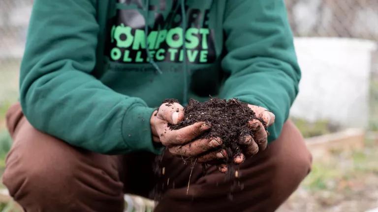 hands holding compost