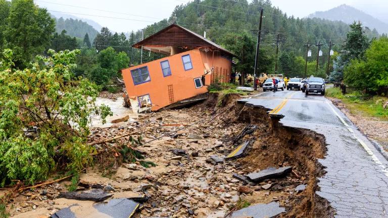 A building and road severely damaged by flooding in the small mountain town of Jamestown, Colorado on September 15, 2013.