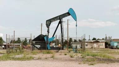 An oil pumpjack near homes in Monahans, Texas