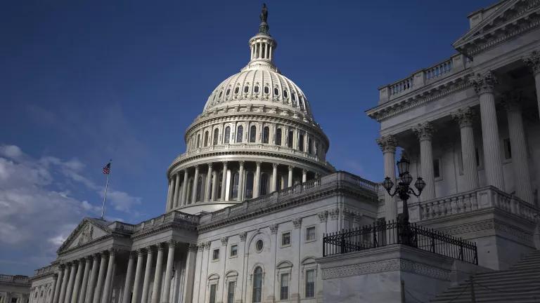 A view of the U.S. Capitol building with a blue sky